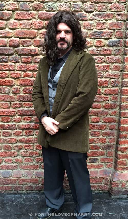 A man dressed up in a Sirius Black costume