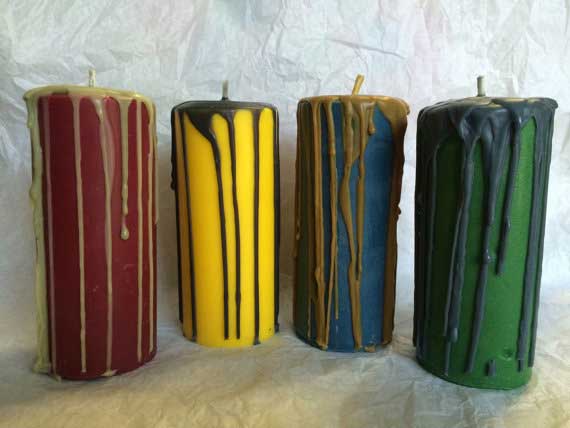 Drip candles in the colors of the four Hogwarts houses