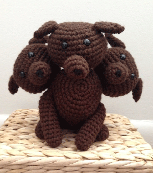 Amigurumi version of Fluffy the three-headed dog on Etsy