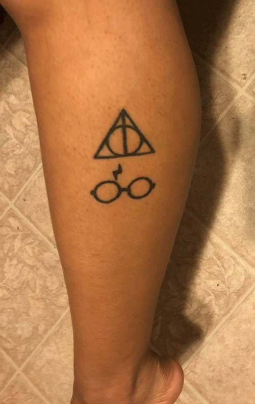 Tattoos of the Deathly Hallows symbol, a lightening bolt, and Harry Potter's glasses. #hp #harrypotter #potterhead #deathlyhallows #tattoo