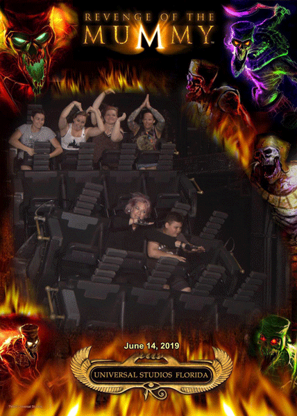 Dawn, Brandy, and Vanessa riding The Mummy at Universal Studios, doing YMCA with their hands.