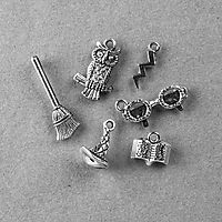 Set of six charms being given away by Half Price Books