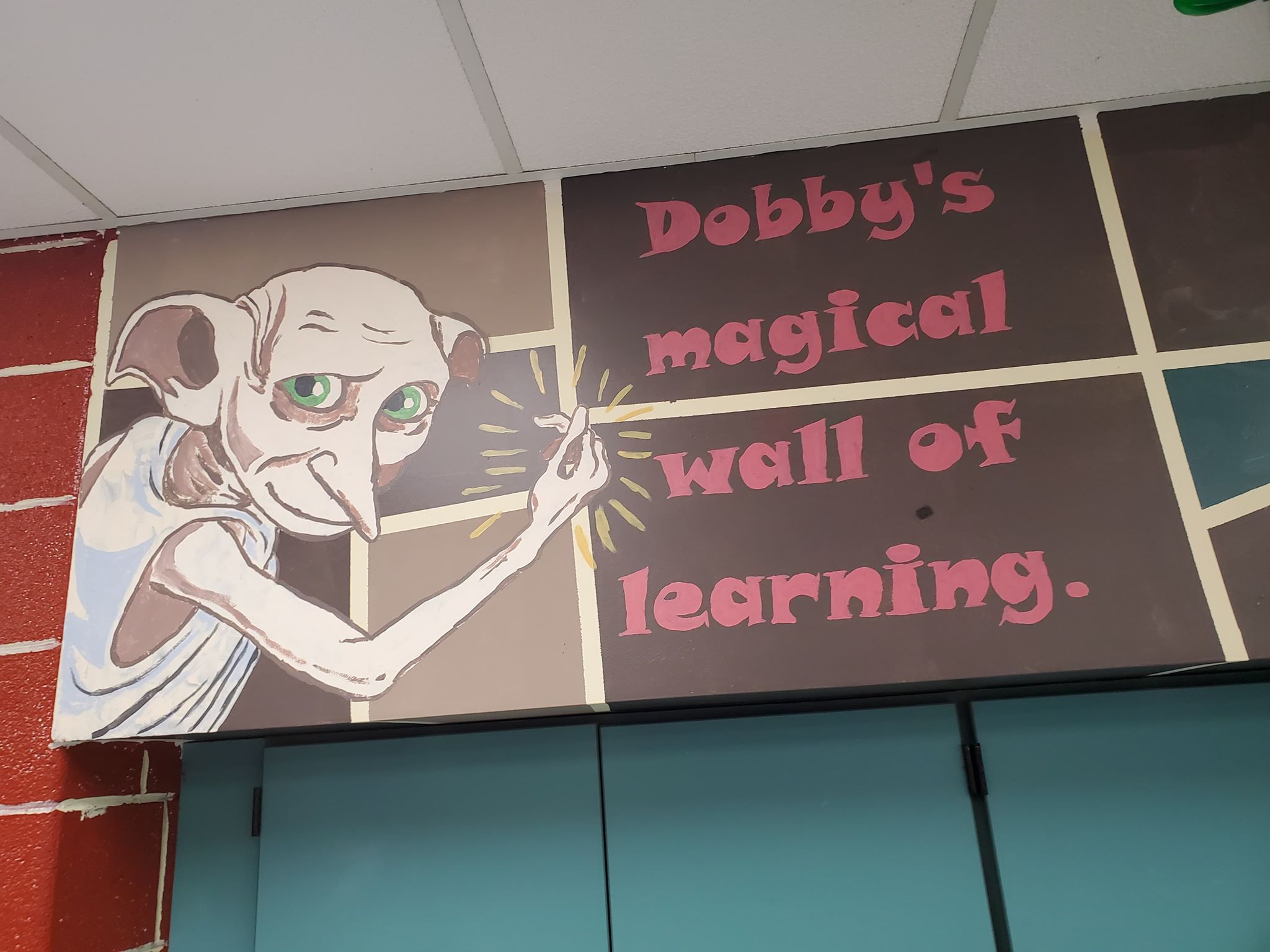 Dobby's magical wall of learning with Dobby the house elf.