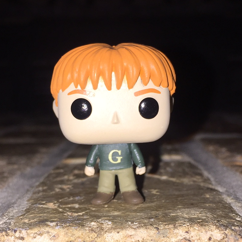 George Weasley wearing a 'G' sweater