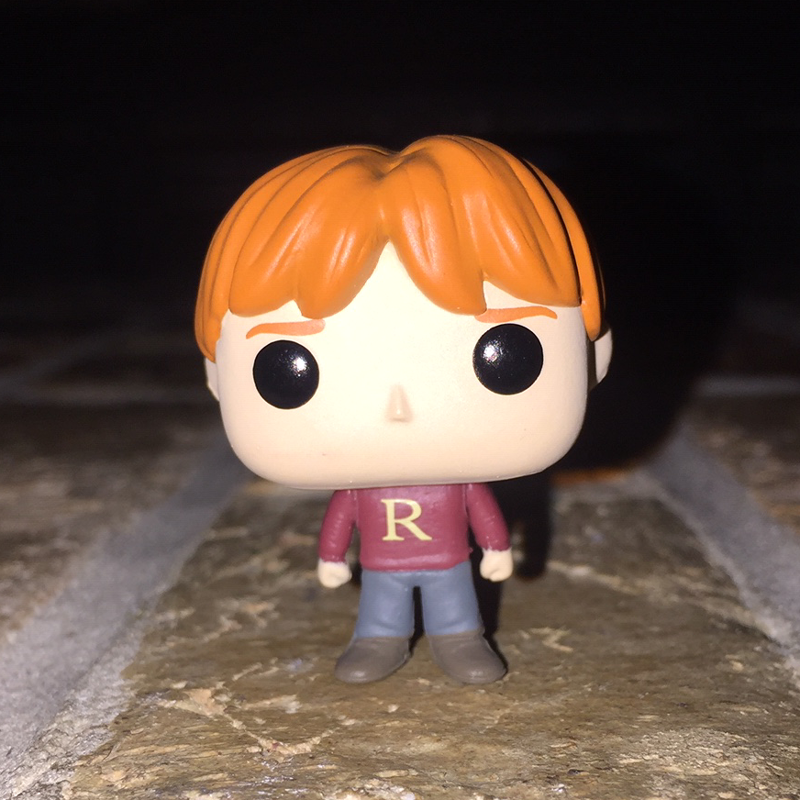 Ron Weasley wearing a 'R' sweater