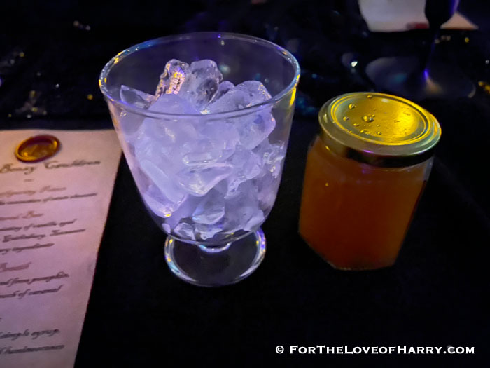 The contents of the jar were to be poured into the cup of ice