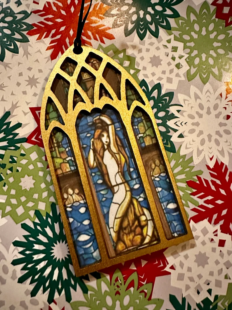 Ornament of a mermaid sunning on a rock