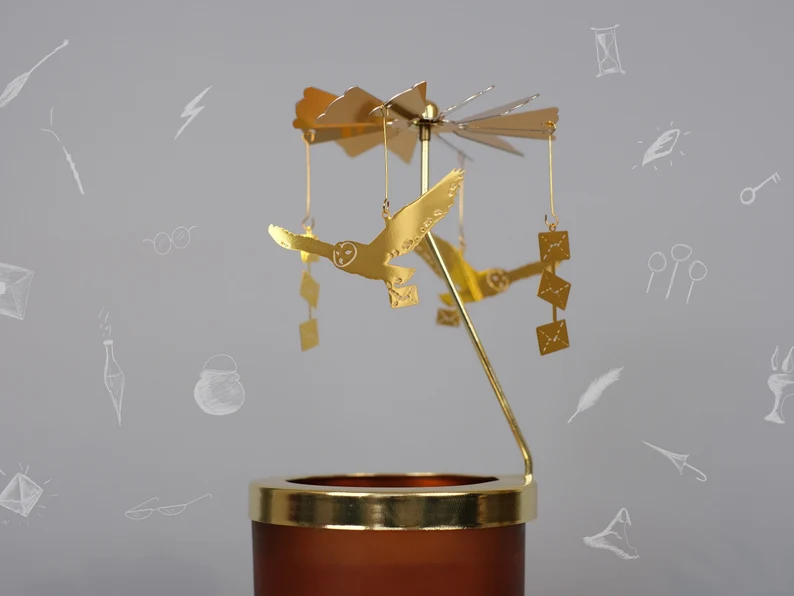 Christmas candle carousel with owls and Hogwarts letters